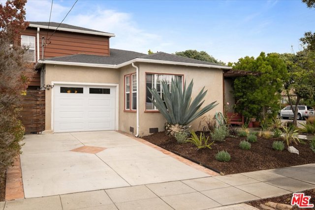 1037 Hill Street Santa Monica, California Charming traditional remodeled home in Sunset Park on corner lot. This bright and sunny 3-bedroom home has double paned windows and hardwood floors. In the kitchen, maple wood cabinets, granite counter tops, stainless steel appliances open to the living room. The bathroom has travertine shower tiles and floors in bathroom with separate tub and shower stall. Direct access to home from one car garage and an extra parking space in front of the garage can be utilized. Plumbing was updated with copper plumbing. Low maintenance landscaping. There are two side patio/run areas including a back patio/yard area with bright pink Bougainvillea which can be seen thru the bedroom windows and bathroom windows