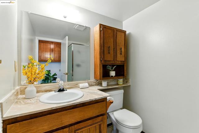 Full bathroom with vanity and a stall shower
