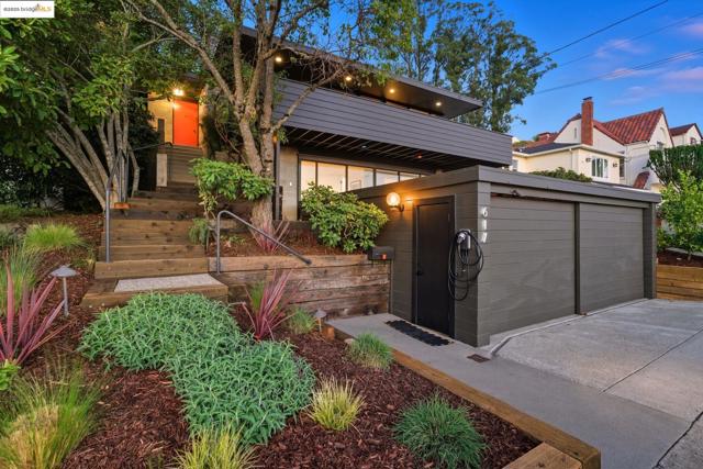 View of outdoor structure with a garage and a balcony
