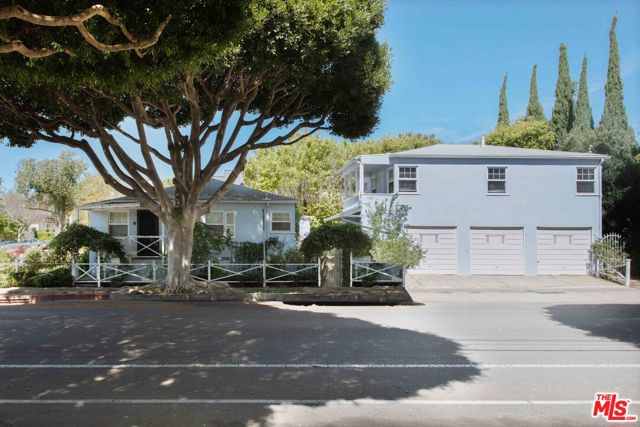 1701 CALIFORNIA Avenue Santa Monica, California AN URBAN RETREAT. Nestled in Mid-City Santa Monica you'll be close to it all, but still secluded enough to enjoy the sanctuary-like conditions. This incredible corner property is a rare find! Located in a wonderful neighborhood this charming Cape Cod cottage style main house features incredible natural light throughout the charming open concept layout with 2 bedrooms / 2 bathrooms, hardwood floors, stainless steel appliances, Carrera counters, and many other wonderful amenities and upgrades, including a dual fireplace! The detached 2 car garage also offers additional storage space. The surrounding greenery offers a mini-oasis and separation from the secondary unit on the property. Close to everything, but also far enough away from it all. The secondary upstairs unit is light and bright featuring stainless steel appliances and hardwood floors. The unit is flooded by light and has lots of closet and cabinet space. Your neighborhood is the beach, Montana Ave., Santa Monica Performing Arts Center, Santa Monica Seafood, The Fairmont and Huntley hotels, and more!: