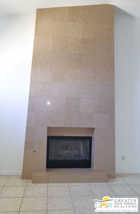 Ultra Modern Granite Clad Floor To Ceiling Fireplace