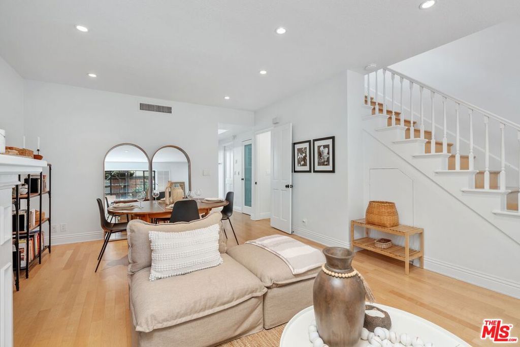 North of Montana, among multi-million homes & just steps from the Palisades Park bluffs overlooking the Pacific Ocean, this is a fabulous, three-level townhome (with private elevator which accesses all three levels).  This property is just blocks from the trendy shops & restaurants of Montana Avenue.  Enter through this very special, lush, verdant courtyard with mature trees and landscaping.  This townhome features two bedrooms and a sunny, good-sized office/den with closets (which could be converted to a third bedroom).  Among the many features are; wood flooring though-out, central heat & air, laundry upstairs & good separation of bedrooms for privacy.  The sunny kitchen has a huge bay window looking out on to the good-sized patio and lots of greenery.  Enjoy warm evenings BBQ'ing on the Weber grill (which stays with the property) on the patio.   The entire top level is the large, primary suite with soaring ceiling and lots of light, a separate seating area, a walk-in closet, a roomy primary bath with double sinks, a separate shower & tub and a huge bay window.  The primary suite is topped off with and a charming private patio.   Stairway from the main-level private patio takes you down to the two, side-by-side, deeded parking spots and storage in the gated community garage.  This is a special property - not to be missed.  Please see "Doc(s)" link (above) for the floorplan & additional information.  Please see the "Virtual Tour" link (above) for the self-directed, 3-D virtual tour.