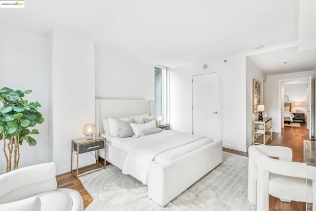 Bedroom with wood finished floors and baseboards