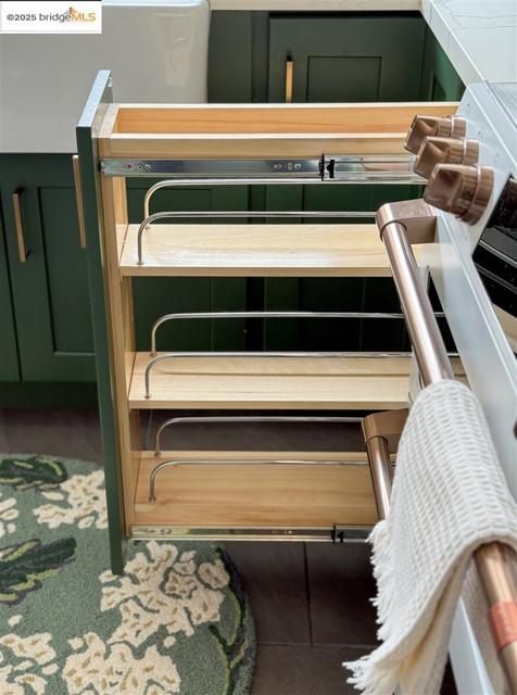 Kitchen view of green cabinetry