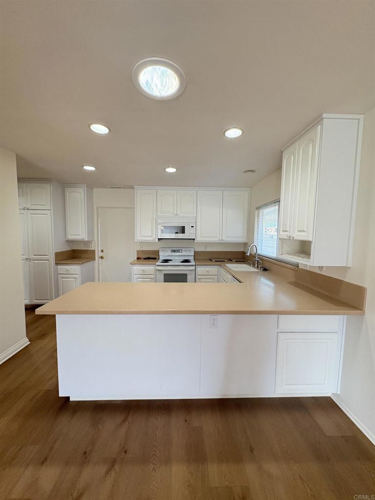 2 Miles away from Cal State San Marcos! 3 large bedrooms plus two full baths with two car garage plus fenced backyard . Brand new flooring throughout - new paint etc. Lake San Marcos Resort Style Living! Beautiful ranch-style single level home on the golf course. Living room opens to large glass-enclosed bonus room looking out on the golf course's pond, ducks & all. Upgraded with granite countertops. Large 3 bedroom 2 baths, with lots of natural lighting. Home is situated back from the street with large front yard. Open kitchen with breakfast bar, great family room. Wonderful views of championship, golf course, this single-family home in this community offers easy access to both beach life and the city scene, while enjoying San Marcos' small-town vibe and rich recreational programs .