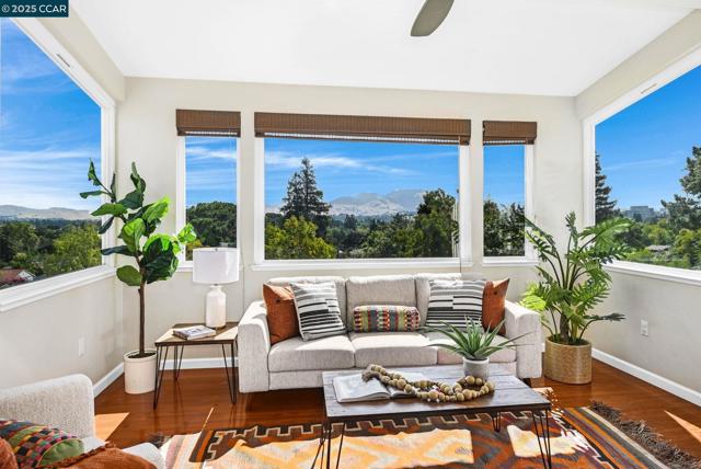 Family Room Surrounded by Picture Windows