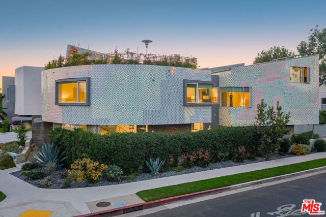 741 California Avenue Venice, California Experience the creative ingenuity of Venice in this magnificently designed home by R&D Architects. 16,000 beautiful custom tiles by the internationally renown artist FAILE adorn the exterior, making this home a truly singular art piece in itself. Inside, sleek lines of exposed concrete are coupled with dramatic walls of glass inviting in the ocean breezes and beautiful light - all day long. European frameless cabinets add style and storage to the gourmet chef's kitchen featuring a convenient dining bar. The XL roof deck with stunning panoramic views embodies the very essence of the California indoor/outdoor lifestyle. Perhaps most importantly, this Platinum Green rated home features solar hot & recaptured rain water, high efficiency heating and air conditioning - truly a gift to our beautiful planet! Walking distance to all Abbot Kinney shops and restaurants, this is an absolute must see!