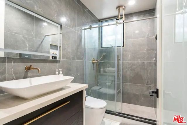 The first floor has a full bathroom, which is located near the main entrance