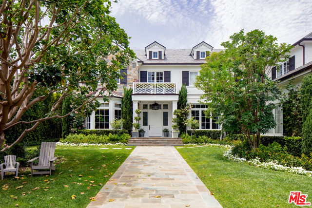 221 S Rockingham Avenue Los Angeles, California Exceptional gated Traditional estate on a lg sun-filled lot with gorgeous vus in the finest BW Park location. Set behind towering redwoods, tall gates & hedges on just under 25k SF of land on the coveted Rockingham Rim, this timeless classic features almost 9500 sq ft, all above ground, w/ the perfect flr plan, grand scale, high clgs, gracious public rms, ideal indr/outdr flow & state-of-the-art audio/video, security & automation. Every imaginable space, amenity & comfort can be found here incl 6 BR suites, 2 fam rms, sumptuous master w/ lavish bth, sit rm, terrace & 2 closets, media rm/playrm, paneled library, gym, elevator, mudroom, 4 masonry FPs, 3 car garage & back-up generator. Fab cook's kitch/fam rm with lg brkfast area opens to loggia w/ heaters, TV, long lap pl/spa w/ pool-side cabana & gorgeous, resort-like grounds w/ lovely vus. Warm oak floors, exquisite finishes & extensive woodworking. In close prox to the Ctry Mart, this home will envelop you in quality & elegance.
