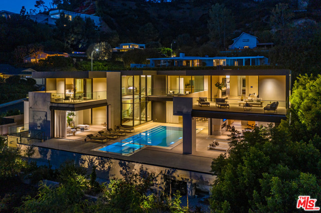 9255 Swallow Drive Los Angeles, California "California Dreaming" Not your typical party house in the Bird Streets. This rare 2-story, 12,237sqft Modern works beautifully as a full-time residence with 7 bedrooms and 12 baths. Panoramic views are framed by mature landscape. Lush gardens with large infinity edge pool. Complete Indoor-Outdoor lifestyle. Amenities include: theater, walk-in wine cellar, a full wellness retreat with resistance pool, plunge pool, dry sauna and gym/massage room. Complete with smart home technology and all the amenities one could imagine. Minutes to Sunset Plaza and the finest stores of Beverly Hills. Excellent value in a most prime location.