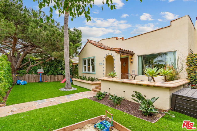 This jaw-dropping 1920's Venice Spanish is a total vibe. Extensively renovated in 2018 to honor the original architectural integrity, while epically modernizing for the ultimate experience in today's beach living. A great room that WOWS... herringbone wood floors lead the way from a cozy, sky-lit living room with gorgeous handpainted tile fireplace into the heart of the home; a designer-perfect kitchen completely dressed with Carrera marble counters and backsplash, LaCanche range, party-perfect built-in dining booth and an entertainer's island. Soothing primary suite opens directly to the yard. The entire exterior was exquisitely polished with large turf frontage, period landscaping, and a magical backyard with heated pool and swim jet to complete an indoor/outdoor paradise. Private dog run. Central heat and A/C. Flex garage space updated for work-at-home opportunity. This sun-kissed property brings all the warmth in an incredible location just moments to Abbot Kinney Blvd, Rose Blvd, and the beach.