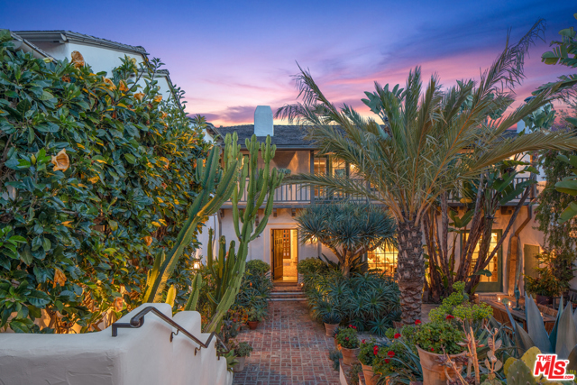 1650 Amalfi Drive Pacific Palisades, California One of John Byers' greatest works... an early-California hacienda with Ocean views in the Pacific Palisades coveted Upper Riviera. Enter the walled and gated estate through a dramatic center courtyard to two grand living rooms with white-washed stucco walls, soaring ceilings and hand-stenciled wood beams, with original pocket doors/screens that open to multiple patios. A formal dining room, gourmet cooks kitchen, butlers pantry, walk-in pantry, laundry room, complete the first floor. Upstairs, the oversized Primary suite includes a sitting room with fireplace, lavish bath, two-walk-in closets, and balcony with ocean and city views. Two en suite bedrooms, an office, linen closet & cedar lined closet complete the second floor. The exceptionally private 4-bedroom, 5-bath, 6,800sf home features native gardens, with a meditative labyrinth & multiple flagstone patios, saltwater lap pool & jacuzzi.