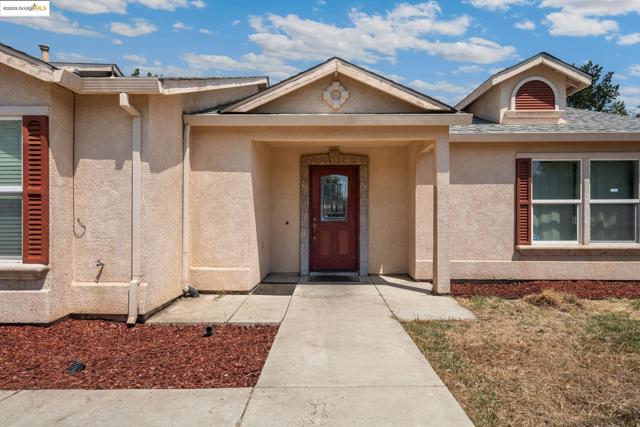 Property entrance with stucco siding