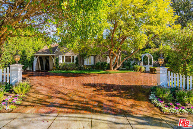610 N Rexford Beverly Hills, California A true description of a "charming storybook home". Hard to find, just under 3000 SQFT, single level home, spread over 14,300 sqft lot. Bright & sunny throughout. Formal LR with pitched ceiling, & a wood-burning fireplace. Formal DR with a picturesque window & white wood-paneled walls. Beautifully tiled country kitchen, w/ stainless appliances, a large walk-in pantry & Breakfast area. Fab den w/doors looking out to the backyard. Huge MBR suite in its own wing for privacy. Has several closets w/built-in shelves, & a large walk-in. Adjoining sitting room, w/a wood burning fireplace, dedicated just for this romantic master suite. There are 2 additional bedrooms in the main house. 4th BR converted into a den. Spread out on 1/3rd of an acre, with lushly landscaped backyard. Large enough to add a huge swimming pool. A separate GH structure that can be configured to ur needs. An amazing buy, listed for less than land value. Short stroll to fancy shops & famous restaurants in the heart of BH.