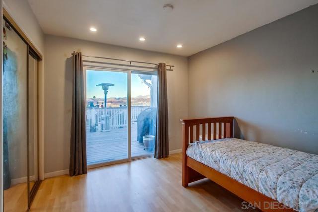 Bedroom with view and slider out to wood view deck!