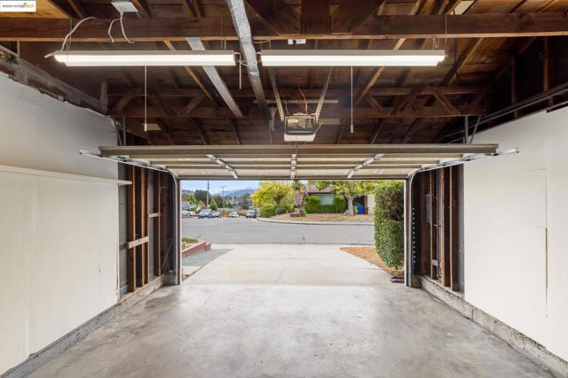 Garage featuring a garage door opener