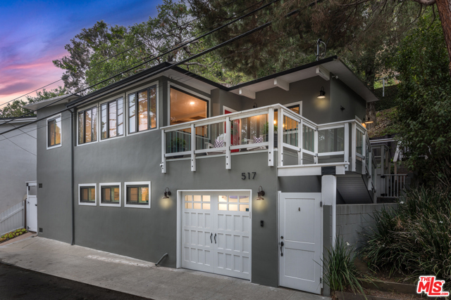 517 W Rustic Road Santa Monica, California Nestled amidst the stunning Oaks in the famed Santa Monica Canyon, this Chic California Beach Bungalow awaits! Featuring 4 light filled spacious Beds (one currently being used as a home office), 2.5 Baths, Hardwood Floors throughout, Cook's Kitchen ideal for any Chef complete with custom cabinets, stainless appliances and honed stain resistant counter-tops. Kitchen opens out to the warm and inviting Dining & Family Room complete with cozy Fireplace. Private and Gated on a quiet creekside lane, this home is beautifully landscaped with romantic terraced hillside gardens. The yard includes multiple Entertainment & Dining spaces ideal for Dining Al-Fresco and a grassy knoll perfect for sun-bathing or a play set. Enclosed 1-car garage and 2 street spaces directly in front of property allow for ample parking. Only a few blocks to the highly sought after Canyon Elementary School, and just minutes to Coffee, Restaurants, Montana Ave's finest shops and the Beach. Don't Miss this charming hideaway in the heart of the city!
