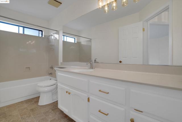 Full bathroom featuring shower / washtub combination and vanity