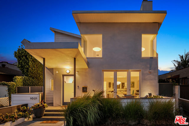 1021 Pine Street Santa Monica, California Comfortable, architectural home on a tree-lined street close to everything Santa Monica has to offer. The double butterfly roof sets this home apart and invites you through the front yard to the large porch. Designed with great attention to detail, this home features 14 clerestory windows illuminating the interior with natural light, wood floors adding warmth, built-in custom cabinetry, and an open floor plan that flows from living to dining to the kitchen. French doors open from the front porch to the living room with two-story ceilings, ample wall space for art, and fireplace. The kitchen has a breakfast bar, tons of storage, and high-end appliances. The main floor includes the primary suite with a spa-like ensuite bathroom and it opens to the rear yard offering fruit trees. The gated driveway leads to the oversized detached garage. The good-sized second ensuite bedroom is also on the main floor. Upstairs youll find the third ensuite bedroom, a large airy loft family room, laundry room, office space, and a spacious deck with gas BBQ hookup and mountain views. This happy and bright home is in a great neighborhood with easy access to the beach, local restaurants, Gelsons, Whole Foods, coffee shops and all of the Santa Monica local favorites!