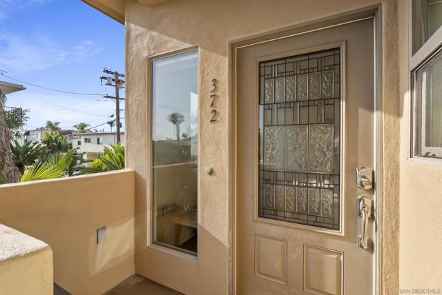 Front door to an inviting coastal unit