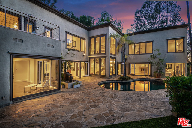9505 HIDDEN VALLEY Road Beverly Hills, California Beautiful contemporary estate located in prestigious Hidden Valley Estates, a celebrity studded 24/7 gated guarded community. Situated behind secure gates with an elegant long private driveway perched at the highest elevation on the street for ultimate privacy and commanding views. Stunning 5 bedroom, 6 bath, open floor plan where most rooms open to the exterior serene gardens and pool for ultimate indoor -outdoor California experience. Additional features include dramatic 30+ soaring ceiling skylight entrance, new large gourmet kitchen with breakfast room & formal dining area, Huge 1,800 s.f. primary suite with magnificent views, dual baths, spa tub, dual walk in closets, abundant marble , fireplace, seating area, private terrace, and new flooring! Private maids quarters with separate service entrance, parking for over 10 cars! Stunning half acre -resort like grounds with numerous decks, terraces and pool create the perfect entertainers paradise.