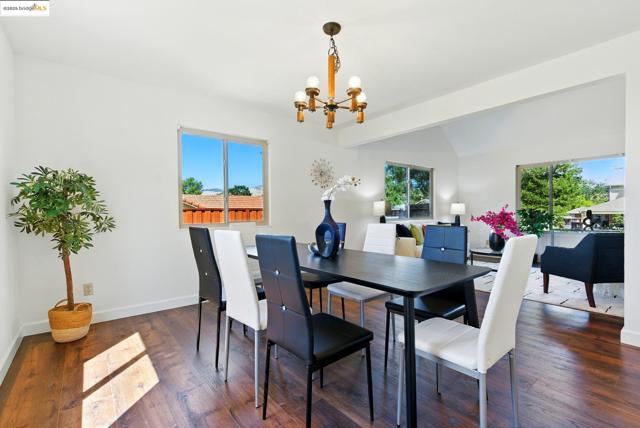Dining area featuring a chandelier and wood finished floors