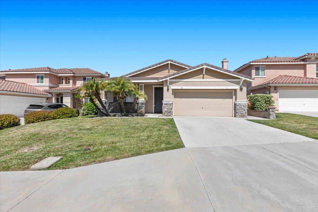 For lease! 3 bedroom plus office/bonus room, 2 bathroom single story home with views on a cul de sac street! Enjoy ocean breezes and evening sunsets in large private yard. Single story living with an open floor plan and high ceilings, large dining room living room combo with wood like porcelain tile flooring, a kitchen and family room with tile, cozy fireplace and a sliding glass door leading to spacious paved back yard patio.  There are 3 bedrooms and 2 bathrooms including a spacious primary suite with luxury vinyl plank floorings walk in closet, en-suite bathroom and ceiling fan. Equipped with AC ceiling  fans throughout.Ideally located in desirable Santa Fe Hills, with parks, tennis courts and a community pool nearby as well shopping, a hospital, hiking and biking trails and easy 78 freeway access to the beach. Zoned for nearby, popular Paloma Elementary and San Marcos Unified Schools. Pets ok with fee. Not equipped with fridge, washer and dryer.