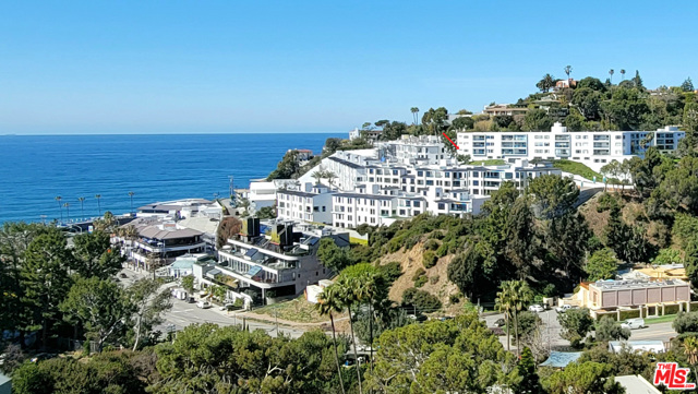 17337 Tramonto Drive 112 Pacific Palisades, California Seaside setting with sweeping views of the ocean, coastline, mountains and an amazing evening view of the coastal lights. This wonderful remodeled 3 bedroom, 2 bath single level condo on the first floor located at the ocean end of the building. Step out to the spacious balcony from the living room and primary bedroom with wonderful panoramic views from the Mountains to the Sea. Enjoy the beautiful high quality Chefs kitchen, sleek Quartz Countertops, custom glass tile backsplash, center island/breakfast area. The Dining Room is a Jewel Box with recessed lighting and conveniently adjoining the kitchen. The fabulous primary bedroom, a room of serenity has ocean and mountain views. The primary bath offers a jetted tub and separate shower. The Second bedroom includes a Murphy Bed, built-in bookcases and opens to an outside area with ocean views and a wonderful place to watch the sailboats go by. The third bedroom/office features a Murphy Bed with built-in desk area overlooking the ocean. The building exterior has been recently painted, the walkways and the pool decking area have been resurfaced and glass railings have been installed on the balconies. The location is fabulous being close to the beach, hiking trails, restaurants, market, Lake Shrine and Getty Villa. Adjoins the new One Coast Development of Luxury Condos. See Private remarks regarding Parking.
