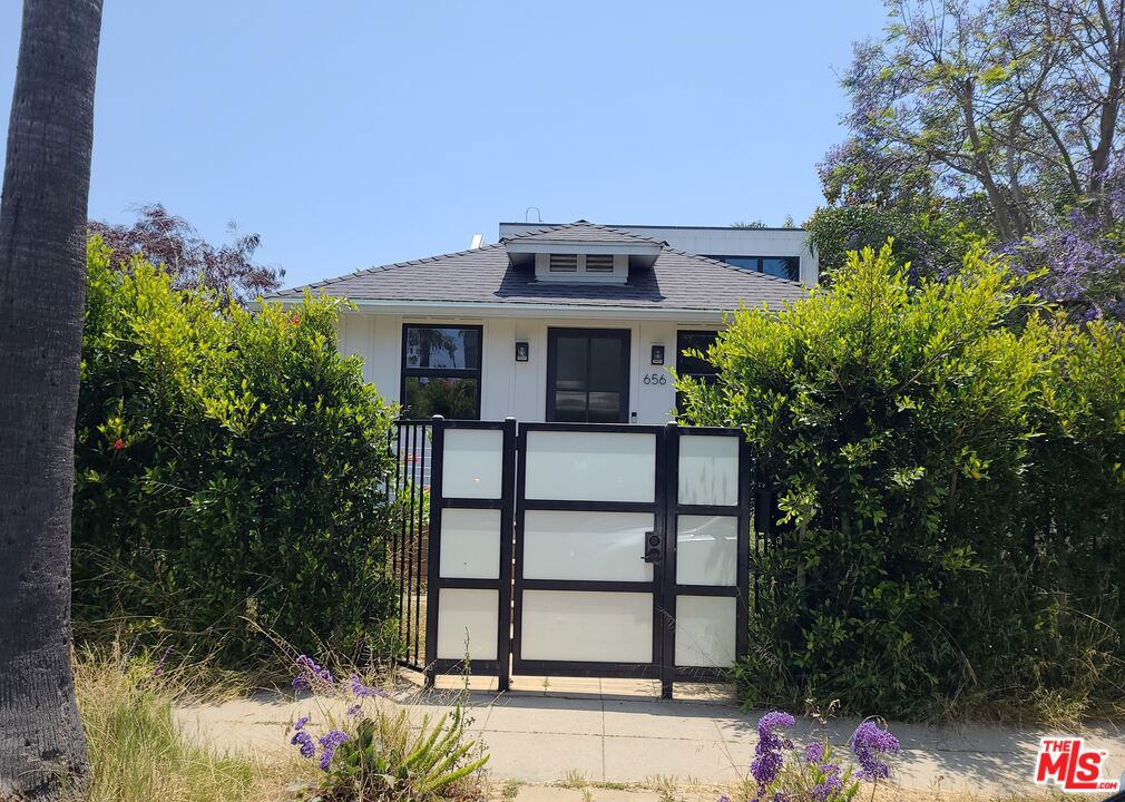 Built in 2020, this Venice gem is designed for seamless indoor/outdoor living and entertaining. The home features four spacious bedrooms and four and a half baths, set within an open floor plan highlighted by warm oak wood floors and a cozy gas fireplace. Fleetwood doors lead to a stylish outdoor lounge area. The bright, modern kitchen boasts contemporary lighting, a marble waterfall island, Miele appliances, a built-in fridge, and stunning cabinetry. A convenient en-suite guest room with a large closet is located on the first floor, ideal for hosting friends and family. The second floor includes two additional en-suite bedrooms and a master suite with a generous walk-in closet, a private balcony, and a luxurious spa-like bathroom with heated and lighted mirrors. The expansive sky deck offers breathtaking 360-degree views and refreshing Venice sea breezes. Situated on a peaceful and sought-after street, this home is truly a must-see. Property is being sold occupied by tenants.