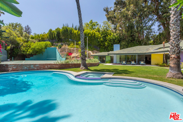 1009 N Beverly Drive Beverly Hills, California Ultra-private, gated, tennis court property set on a flag lot just over 3/4 of a flat acre. This is a hidden, quiet, prime development site, and seller is open to offers in BITCOIN or providing seller-financing. Neighboring parcels are also being marketed for sale, and presents a rare opportunity to own all three and create once in a lifetime Beverly Hills Compound! Home has recently under gone a major remodel. Once a 4br/5ba home, this residence has been converted into a 2br/3ba retreat. At just under 3,500sf, the Master is complete with vaulted ceilings, fireplace, sitting area, oversized walk-in closet and master bath. The guest quarters, in addition to all the living areas, spill out to the outdoors with pool, rose garden, vegetable gardens and tennis court. Oversized kitchen, bar area, outdoor cave, skylights and more create the perfect understated, elegant escape in possibly the world's most coveted zip code, 90210. Conveniently located less than a mile from the Beverly Hills Hotel, 1.5 Miles to the shops on Rodeo Drive and SOHO House in West Hollywood!!!