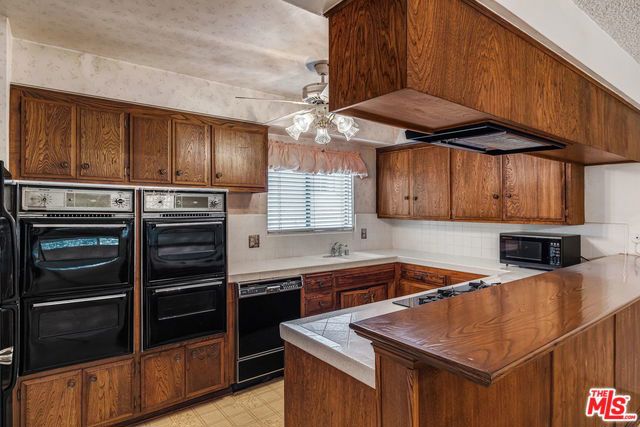 Original 1970s kitchen at 5229 Balboa Boulevard 42 before renovation