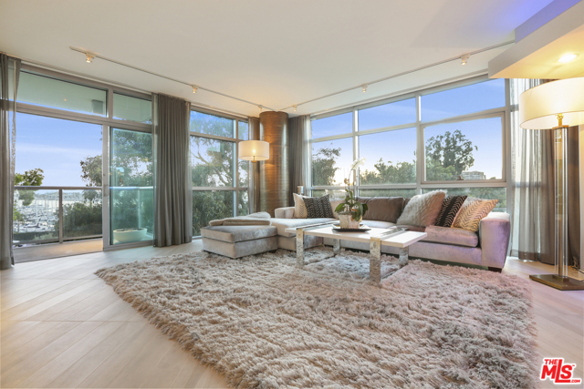 13700 Marina Pointe Drive 405 Venice, California This stunningly re-imagined spacious corner unit with Marina and oceans views in the Azzurra, a coveted full-service community is sure to impress. Enjoy Marina living at its best in this luxurious contemporary property offering generous 9 foot high ceilings, impressive floor to ceiling windows, multiple balconies and of course the amazing views. The modern design emphasizes crisp clean lines with a warm neutral palette accented by textured wallpaper, custom paints, custom lighting design and gleaming ceramic floors. Full-service amenities include 24/7 security, concierge and valet parking. You will feel like you are on vacation all year round with the resort like features such as saltwater pool, rooftop Sky Lounge media center and conference rooms. With an indoor and outdoor fitness centers and Yoga and Pilates studios a healthy body and mind awaits. Walking distance to the Marina, dining and entertainment. A quick bike ride to the beaches and quick Uber to LAX.