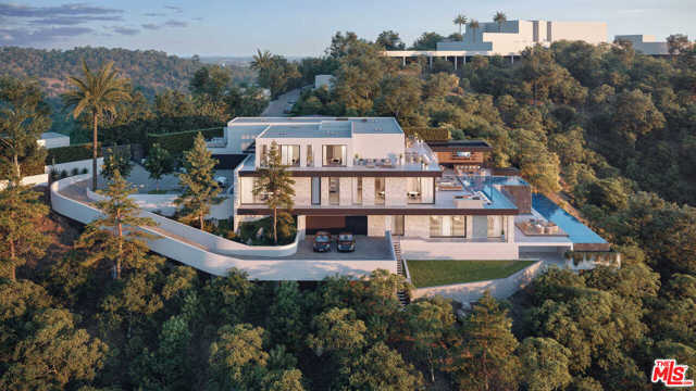 1035 Stradella Road Los Angeles, California Situated on an ultra-private, tree-lined hillside in Bel Air, this spectacular, new estate captures far-reaching city and ocean views. Envisioned by Bowery Design Group with interior design by Faye Resnick, the estate boasts 1.3 acres, 7 beds, 14 baths, and endless amenities for indoor-outdoor entertaining. Showcasing soaring ceilings and exquisite detail, warm, modern interiors are positioned around a central courtyard. The chefs kitchen with pantry and living/dining areas open through glass walls to lounging terraces, outdoor kitchen, custom bar, infinity-edged pool, and Jacuzzi. On the lower level, find a lounge, bar, 12-seat theater, gym, steam/sauna, wine room, and 2nd 73 pool that extends over the hillside. 7 bedroom suites include staff quarters and a stunning primary suite with 2 closets. Features include an office, oak floors, and 2 garages with parking for 5. Capturing sunrise to sunset views, enjoy the utmost privacy, minutes from the citys best shopping and dining.