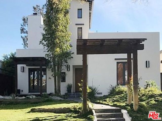 1808 Marine Street Santa Monica, California Architectural home with a view located in the Sunset Park neighborhood on a quiet tree-lined street. This stunning property features a thoughtful light and bright open floorplan; a living room with a fireplace, a lovely dining room, and a fabulous chef's kitchen that leads out to a private and serene backyard perfect for entertaining with a built-in barbecue and built-in seating that surrounds a fire pit. The home features 4 bedrooms with a bonus den/office space. The primary bedroom has both ocean and city views, a fireplace, and a large bathroom and closet. Located blocks away from the quaint shops and cafes on the pedestrian-friendly Ocean Park Blvd.