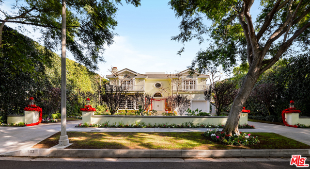 902 N Roxbury Drive Beverly Hills, California Exclusive, tree lined North Roxbury Drive. Gorgeous traditional with flawless floorplan. inviting double height entry, high ceilings throughout, contemporary open plan combined with formal living spaces. Fabulous eat-in chef's kitchen, Breakfast rm, Family rm with bar, oversized Living rm and formal Library. Grand Master with large sitting area, 2-Master bath suites fit for the most eclectic taste, each with extensive walk-in, fully built-out wardrobe closets. Large junior suite and 2-additional secondary suites each perfectly situated for privacy ensuite. Exquisite details, crown mouldings, millwork, cornices, wall paneling, sweeping curved staircase and many built-ins throughout reminiscent of exquisite quality builds of years past. Maids rm down plus 2-room guest or staff house in backyard. Pool and beautiful entertaining loggia for fabulous parties or intimate family evenings. First time on market in over 30 yrs. A rare treasure in prime Beverly Hills for your family to enjoy!