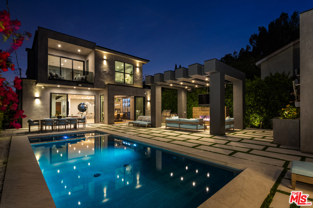 1371 Palms Boulevard Venice, California Find tranquility in this architectural oasis, situated in a premiere Venice location! Designed and built in 2019, this phenomenal home w/ a pool is a true blend of comfort, design, and functionality. Meticulously upgraded, with luxurious amenities and technology - this is an entertainers dream! //About this home: Upon entry, you are welcomed by a sprawling open floor-plan drenched in light as you are surrounded by floor-to-ceiling glass sliders and soaring ceilings. Enjoy a sleek gourmet kitchen, oversized island with built-in seating, custom cabinetry, and a separate wine cellar. A spacious formal living room transcends to the private resort-like backyard, offering indoor/outdoor flow. The state-of-the-art home theater w/ a 4K projector has been upgraded to offer the total audio/visual experience. All bedrooms tastefully designed including your master retreat, with an over-sized walk-in closet, and a spa-like bath with a soaking tub. // We Love: The integrated smart technology. Consolidated and upgraded, all electronics are on a new Savant smart system. //You'll Love: Feel as though you are on vacation year-round in the private, lush, outdoor sanctuary. Jump into the sparkling pool or unwind under the cabana. A detached studio ready to go and plumbed for a bathroom - perfect as a space for guests, your gym, or home office, and 5 parking spaces. This is paradise in the heart of the Westside!