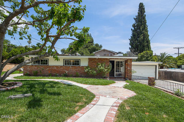 3794 Cloud La Crescenta, California Welcome to 3794 Cloud Avenue, a stunning mid-century three-bedroom, 1 bathroom home located on a large corner lot. Upon entering you will notice the open concept living/dining room with fireplace and kitchen with island. Vaulted and beamed ceilings complete the main living area. The family room is spacious and provides access to a laundry area, the side/backyard with waterfall feature and patio, and bonus room which is ideal for an office or gym. All 3 bedrooms are conveniently located together along with the bathroom. Other amenities include new paint, carpet, floors, light fixtures, central heating and air, a long driveway (room for an RV), a two-car garage, and Blue Ribbon schools. Come experience this wonderful modern Crescenta Valley home!