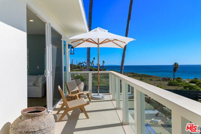 2023 GROUND UP NEW CONSTRUCTION!!! Welcome to the Malibu Bay Club located on an oceanfront bluff offering an incredibly serene beach lifestyle. The west end of Malibu is known for its cove beaches and natural beauty and this property is an ocean lover's paradise, mere steps from the sand and surf. Oceanaire Lane is a penthouse corner unit offering endless ocean and coastline views from Point Dume to the Channel Islands. This unit has been completely rebuilt from the ground up and is the only newly constructed condo in Malibu currently offered for sale. Drenched in natural light, this top corner unit features an open floor plan with brand new finishes top to bottom, large custom kitchen with new appliances, breakfast and dining area, living room with walls of glass and a sliding door that opens to an expansive deck. The oceanside primary suite offers stunning views from every corner with a luxurious bathroom with custom built-ins. The second bedroom has views of the untouched mountains across the Hwy and a secondary bathroom with custom tile work and bathtub. Enjoy unobstructed views towards Point Dume overlooking the state parkland which offers one of the local's favorite surf breaks! 2 car tandem carport plus an additional third uncovered parking space. Private laundry room, A/C, ceiling fans, fire sprinklers, custom shades and window coverings and beautiful fixtures and finishes throughout. Don't miss this rare opportunity to own this BRAND NEW premier penthouse corner unit. The Malibu Bay Club is one of only a few beachfront complexes in Malibu. Gated with secured entry, beautiful pool area with spa and direct beach access to sandy coves.