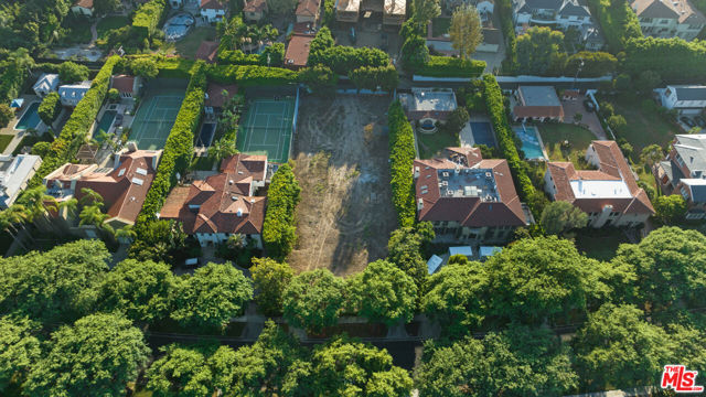 Massive 23,651 square foot lot! An incredibly rare opportunity to build the house of your dreams on one of the most prestigious blocks in Beverly Hills. This vacant lot comes with approved plans for a 25,000 square foot Contemporary Manor style home designed by Gabbay architects. Plans for the home include seven bedrooms and endless amenities like a wine cellar, sauna, screening room, massage room and a nine-car garage. In the basement there is a full kitchen, ballroom with 15 foot ceilings, hair salon, and wine room. A must-see property on a prime street in the flats with endless history and notoriety.