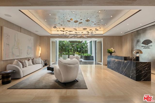9200 Wilshire Boulevard 306W Beverly Hills, California Welcome to the quintessence of luxury living - Residence 306 West at The Mandarin Oriental Residences, Beverly Hills. This elegant two-bedroom, four bath and Den residence, complete with stunning North-facing hillside views, invites you into a world of unrivaled sophistication. The expansive living and dining areas, adorned with French white oak flooring, set the perfect backdrop for high-class entertainment. The custom-designed Molteni kitchen is a culinary artist's dream, featuring a leathered Taj Mahal quartzite curved countertop, exquisite Tabu Birch wood cabinetry, and top-tier Miele appliances. The primary suite epitomizes luxury with a pristine bathroom adorned with French vanilla marble walls, radiant heated floors, Azul de Nordic marble vanities, and deluxe fixtures from CEA Design. Enjoy the benefits of the Mandarin Oriental's legendary five-star service and access to Michelin-starred Chef Daniel Boulud's culinary masterpieces. Nestled atop Beverly Hills' Golden Triangle, this exclusive residence delivers an unparalleled lifestyle complete with a dedicated concierge, a private porte-cochre with 24-hour valet. Amenities include a fireplace library and lounge, dedicated meeting room and over 12,000 square feet of resort-style rooftop amenities, including a 40' pool with cabanas, daybeds, and lounge chairs, residents-only spa with treatment rooms, steam room, sauna, and outdoor relaxation terrace, state-of-the-art Fitness Center equipped by Technogym, yoga studio, outdoor meditation terrace and an indoor-outdoor restaurant offering sweeping views. Welcome to your own sanctuary of effortless sophistication at The Mandarin Oriental Residences. Photos may not represent actual unit.