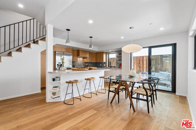 2219 Virginia Avenue 1 Santa Monica, California Welcome home to this impeccable, light-filled townhome in the heart of everything Santa Monica has to offer! This newly constructed architectural home, completed in 2021, is a modern retreat that beautifully blends indoor/outdoor living at its finest. //About this home: Exceptionally designed, this 2 Bedroom/2.5 Bath front unit offers a spacious floorplan and is drenched in natural light. Finished with an earth-toned, organic palette that exudes sophistication and warmth. Enter the main, open living space that offers an 11' ceiling, white oak flooring, picturesque windows with views of the lush mature trees, and an exquisite cozy brick fireplace. Designer lighting throughout and a fabulous gourmet kitchen featuring Bosch stainless steel appliances, Quartzite counters, and a stunning Tilebar backsplash. A perfectly situated private outdoor patio is an extension of your living space and is ideal for entertaining! Upstairs enjoy two spacious bedrooms, including your light and airy primary retreat with voluminous ceilings and ample closet space. Luxurious bathrooms are finished with Kohler fixtures, Bedrosian's wall tile, and in-shower skylights in the primary bathroom. //You'll Love: Your private roof deck! Enjoy the sunrises, sunsets, and ocean breezes! //The Neighborhood: Across the street from Virginia Ave Park, enjoy endless opportunities to play and enjoy the outdoors. Only 1.5 miles to the beach, a short walk to the Expo Line, the Pico Branch Library, the Farmers Market, 365 Wholefoods, and minutes to restaurants and shops on Ocean Park. This is SoCal living at its finest and an opportunity that will not last long! OFFER DEADLINE, Thursday 10/7 @ 12:00pm