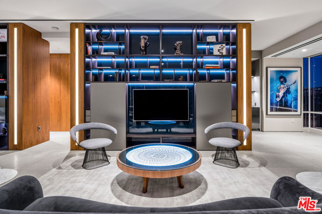 1200 CLUB VIEW Drive PH-1800 Los Angeles, California In one of the most exclusive buildings on the Wilshire corridor sits Penthouse 18 at the Beverly West. Spanning an entire floor with approximately 8,000 square feet of living space, 360 jet-liner views of the Hollywood Hills, Bel-Air, the Los Angeles Country Club, and as far as Downtown Los Angeles to the Pacific Ocean. Views like this simply do-not get much better. This truly beautiful unit features a private state-of-the-art chef's kitchen, entertainment bar with a stunning TV-Wall comprising of 4x65" televisions totaling 130" of viewing pleasure. Imagine a dinner with friends and family looking out at a beautiful sunset over the Pacific Ocean, or hosting cocktails overlooking Bel-Air and one of the most exclusive Country Clubs in the country. All four bedrooms are stunning, the finishes are easily a work of art with only the best materials and designs coming together to give comfort and luxury. The master bedroom features a grand and lavish bathroom with the tub framed onto a beautiful view, jewel box steam shower, and powder. Attached to the master bedroom is your own private gym, or space customizable to anything desired. The boutique-style Beverly West offers exclusivity, privacy, security, and ultimate luxury.