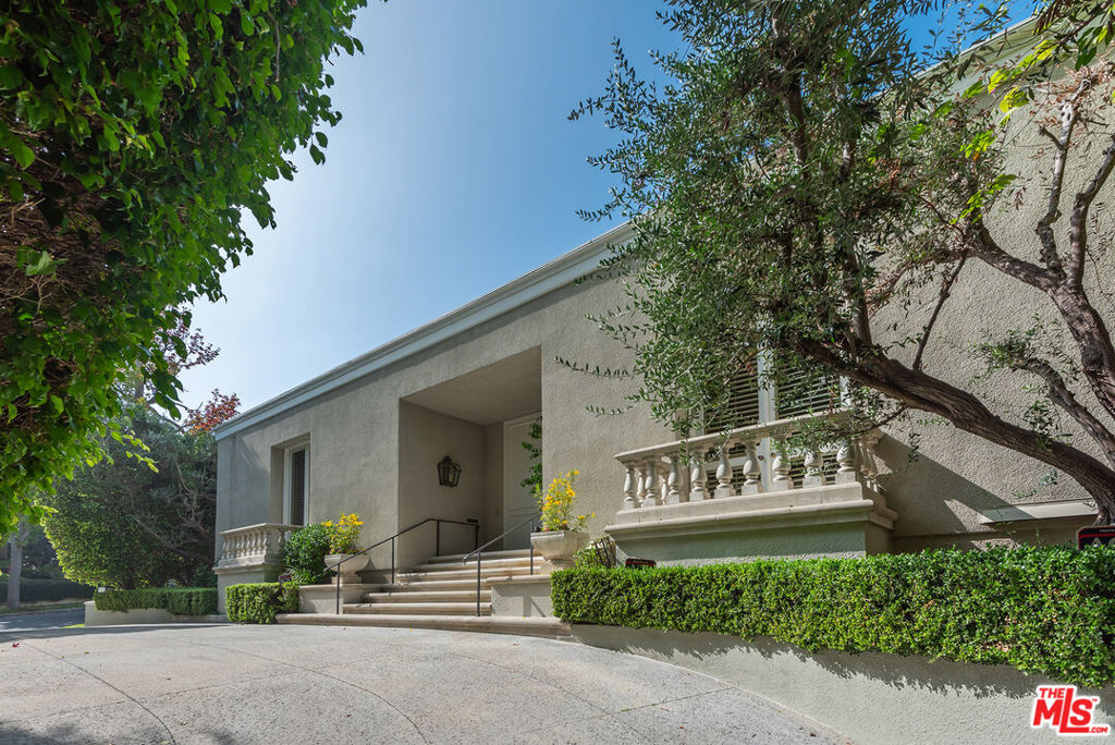 This is the home you've been waiting for! Little Holmby, mid-century, built new in 1990. 3 beds, 4 baths in 4,173 sq ft on a 11,634 sq ft lot, designed by highly acclaimed architect, Hal Levitt. Very rare, sophisticated, one level home with 14 ft ceilings. This "condo on the ground" features a huge living room, 2 master suites, den/library, culinary kitchen, 3rd bedroom. Exquisite herringbone hardwood floors, recessed lighting, 2 fireplaces. Several sets of French doors lead out to the patio and pool/spa area. Sparkling pool recently remodeled. Ample parking includes two car direct access garage, an additional side space and a circular driveway that accommodates 3-4 cars. Warner Ave Elementary School.