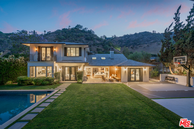 1658 San Ysidro Drive Beverly Hills, California This Spectacular Gated Elegant Hamptons Estate exudes class while capturing today's modern living by providing an exhilarating indoor-outdoor experience perfect for entertaining. This is truly a one-of-a-kind property with six en-suite bedrooms, majestically set back from the street with plenty of onsite parking, top of the line outdoor Viking BBQ, Saline Pool, Spa, Fire Pit, and a Half court Basketball making this backyard the quintessential resort style living. As you enter the light and bright formal living room you immediately feel the room filled with natural light through the skylights and vaulted ceilings. The intimate wet bar in the living room leads you to the Gourmet Kitchen where you can find a large Center Island/Sink, Wolf appliances, and a built-in breakfast nook overlooking the backyard perfect for a morning coffee. This Magnificent home features Built-in Surround Sound, Chic paneled formal dining room, and Italian Marble Wine Display. Situated in the prestigious Beverly Hills Post Office and 5 mins away from The Beverly Hills Hotel makes this home a true modern gem.