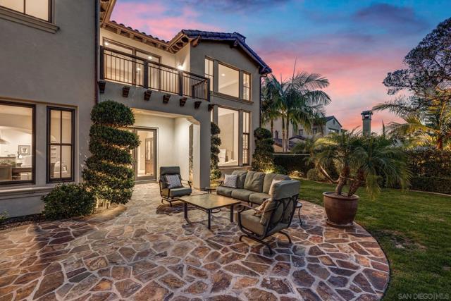 Scenic backyard retreat with a built-in fire pit, stunning golf course and canyon views. The perfect spot to unwind and enjoy breathtaking sunsets.