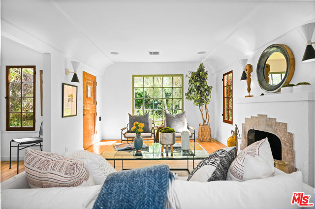 913 Amoroso Place Venice, California Situated on a coveted Venice walk-street, this Mediterranean home offers a quiet sanctuary which effortlessly transports you to holiday mode. The property welcomes you into a lush, private front garden and boasts a rare second outdoor setting in back to entertain under a mature California Pepper tree. The house was remodeled to incorporate modern amenities yet designed to retain its original character. This three-bedroom two-bath house brings the sunlight and outside greenery in with Spanish windows at every glance. Handmade tiles, original hardwood floors, a fireplace, coved ceilings and a cozy breakfast nook are a few of the special features of this home. Speakers throughout and reverse osmosis in the kitchen. The main suite is located upstairs with exposed wood ceilings, multiple balconies and quintessential Venice views, as well as direct access to the backyard. A two-car garage is accessible from the rear alley. The location is perfect, blocks away from eclectic shops and restaurants of both Abbot Kinney and Lincoln and a quick bike ride to the beach.
