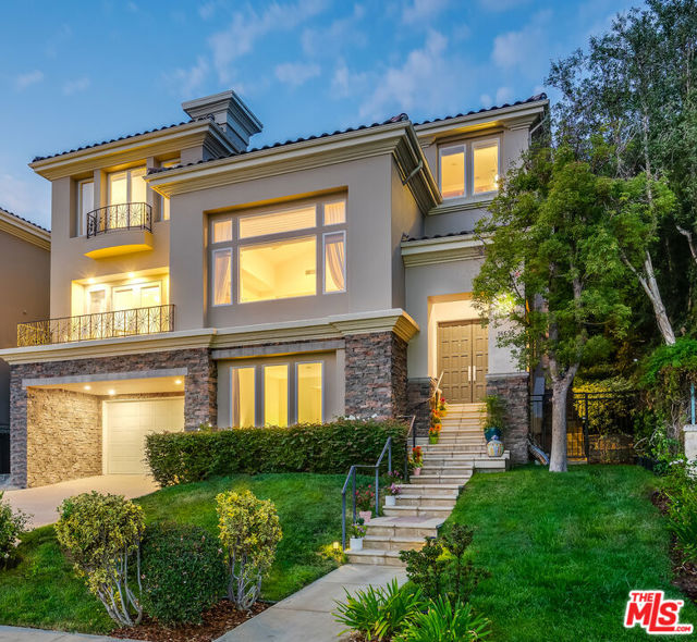 16655 Calle Haleigh Pacific Palisades, California Poised where the air is clean, above the upscale yet small-town charm of Pacific Palisades, this modern tri-level villa is a gorgeous rendition of the classic Mediterranean home. A welcoming foyer with a museum-scale art alcove quells outside cares. Marble stairs ascend to the cathedral-ceilinged living room, awash in natural light, gripped by stunning views of the Santa Monica Mountains, and anchored by a handsome onyx and maple gas fireplace. Wide space creates a natural flow to the formal dining room with its sleek built-in buffet. Refinement meets the wilderness at the view through French doors opening to the balcony. Cut to a gourmet kitchen through the butlers pantry, passing ceiling-high storage for every conceivable appliance and a chefs planning desk. The highest quality appointments and black granite counters surround a center island. A spacious breakfast area unites the den (another fireplace) and cloistered backyard, where a built-in grill and alfresco dining area are perfect for entertaining under the warm California skies. Filigree wrought-iron railing leads upstairs to the sanctuary of the master bedroom, replete with sunset views, gas fireplace, massive walk-in closets, a luxury spa-bathtub and built-in vanity. Two more en-suite bedrooms, overly abundant closet space and cabinetry, and an ocean view study with built-in bookcases complete the floor plan for this top-of-the-world upper floor. The lower level features a sunny en-suite bedroom, bonus room, laundry room, and opens to a two-car garage. This luxury home stands at the crossroads of lavish and smart; ideal for spoiling guests, and nurturing loved ones. Residents enjoy access to the pool, spa, gym, tennis court, and playground of the exclusive Summit Club; and are minutes from hiking and riding trails, superb beaches, the world-class Getty Museum, and the Caruso Village shopping center.