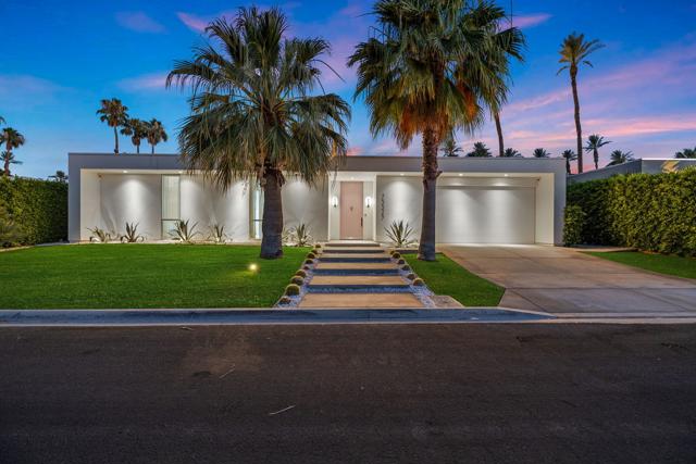 Step into this stunning modern contemporary custom home built in 2018 offering 3,589sf of pure luxury. This home is the epitome of sophistication, featuring every imaginable upgrade for a lifestyle of unparalleled comfort. As you enter through the Palm Springs-inspired pink front door, you'll be captivated by the exquisite design detail and top-of-the-line finishes that elevate every room. Perfect for entertaining, the spacious living areas seamlessly blend style and functionality. The kitchen is equipped with Wolf and Sub-Zero appliances, built-in espresso machine, marble countertops and sleek one-touch cabinetry inviting culinary adventures and ample space for gatherings. With 3 bedrooms, 3.5 bathrooms, an indoor hot yoga studio that can be utilized as a 4th bedroom, this home adapts to your needs. The floor-to-ceiling stacking doors in the living area and primary bedroom open to a show stopping private south-facing backyard with breathtaking mountain views. The primary suite is luxurious with a large bathroom featuring steam shower and modern free-standing bathtub for ultimate relaxation. Unwind in your resort-style pool and spa, enjoy al fresco dining next to the in-ground linear fire pit, or practice your swing on the putting green. Discover the hidden outdoor kitchen, complete with a BBQ and pizza oven for outdoor culinary delights. With smart home devices, owned solar, and a premier sound system throughout, peace of mind is at your fingertips. Sold furnished.