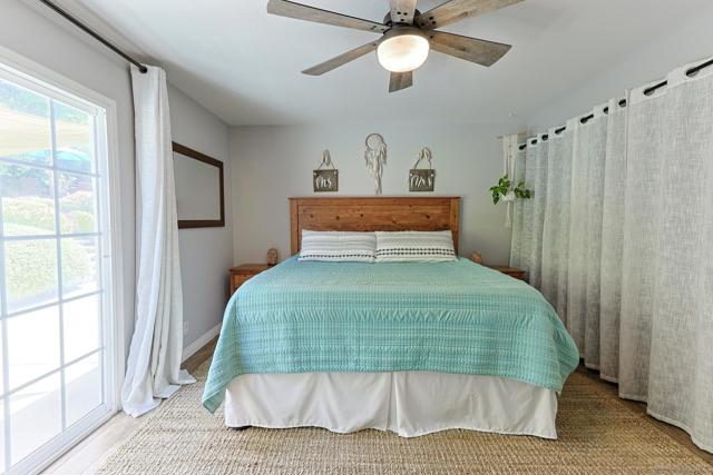 spacious primary bedroom with sliding door to the backyard.