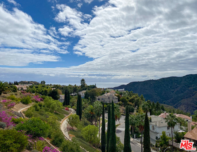 1486 Paseo De Oro Pacific Palisades, California Enjoy exceptional panoramic views of surrounding mountains, canyon, ocean and Catalina Island from this beautiful home situated on a private and gated street in the Palisades Highlands. This turn key residence offers an elegant yet warm interior that is inviting, spacious, and filled with natural light. View spectacular sunsets from the flagstone patio/rear yard w/ water fountain, roll out awning, & gas hookup for BBQ. 4 br upstairs, 3 full bths, 1 half bth, & updated kitchen w/ Thermador appliances, island, granite counters all opening to a large sun filled family rm w/ FP. The master suite has a FP, sitting area, & deck w/ dramatic panoramic vistas. Master bath w separate tub, shower, & walk in closet. Other property features include security system, whole house water filtration system, dual pane windows, inside laundry w/ W/D, direct entry two car garage. Includes membership in the exclusive Summit Club w/ tennis courts, sport court, pool, gym, spa, play area, & club house.